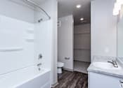 Thumbnail 10 of 27 - a bathroom with a bathtub and a sink