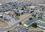 Thumbnail 30 of 30 - A bird's eye view of a residential area with houses and roads.