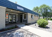 Thumbnail 4 of 30 - A small building with a sign that says Leasing Office.