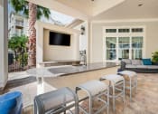 Thumbnail 5 of 25 - a patio with a bar and a couch  at Century Avenues, Lakeland, FL, 33813
