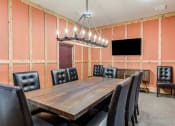 Thumbnail 12 of 29 - accommodation type with a large wooden table and black leather chairs at Century Belmont Station, Louisville, KY, 40243