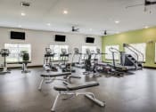 Thumbnail 19 of 29 - a gym with treadmills and other exercise equipment at Century Belmont Station, Louisville, 40243