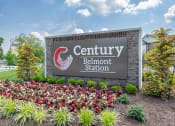 Thumbnail 22 of 29 - a sign for the belmont station with flowers in front of it at Century Belmont Station, Louisville, KY