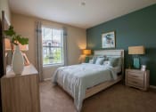 Thumbnail 19 of 30 - a bedroom with a bed and a window at Century Dunes Apartments, Deland