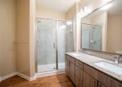 Thumbnail 27 of 30 - a bathroom with a sink and a shower at Century Dunes Apartments, Deland, 32724