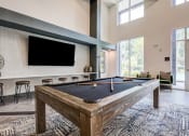 Thumbnail 8 of 32 - our apartments have a game room with a pool table and flat screen tv at Century University City, Charlotte, 28213
