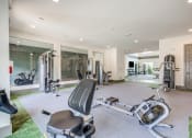 Thumbnail 6 of 32 - a home gym with exercise equipment and a bathtub at Century University City, Charlotte, North Carolina