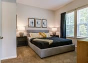 Thumbnail 26 of 32 - a bedroom with a bed and two windowsat Century University City, North Carolina, 28213