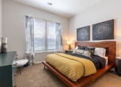 Thumbnail 15 of 32 - our apartments offer a bedroom with a king sized bed at Century University City, Charlotte, NC
