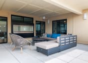 Thumbnail 14 of 28 - a seating area with a sofa chair and ottoman on a patio  at Century West Pryor, Missouri
