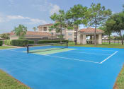 Thumbnail 16 of 29 - tennis court at the whispering winds apartments in pearland, tx at Century South Shore Apartments, League City, 77573