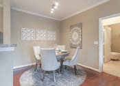 Thumbnail 27 of 29 - a dining room with a table and chairs at Century South Shore, League City, TX
