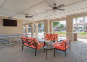 Thumbnail 3 of 29 - a lobby with couches and chairs and a television at Century South Shore, Texas