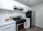 Thumbnail 22 of 46 - Kitchen at The Carter 4250 Apartments, Norcross, GA