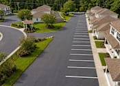 Thumbnail 18 of 21 - A long row of houses with a road in between.