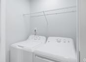 Thumbnail 8 of 25 - A white bathroom with a toilet and sink.