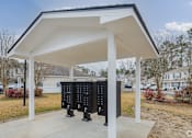 Thumbnail 24 of 25 - A white covered structure with two black panels in front.