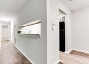 Thumbnail 36 of 81 - a hallway with a sink and a mirror in a house at Magnolia Place at Stockbridge Apartments, Stockbridge