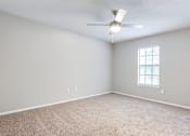 Thumbnail 72 of 81 - bedroom with a ceiling fan and a window at Magnolia Place at Stockbridge Apartments, Stockbridge, GA, 30281