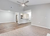 Thumbnail 48 of 81 - an empty living room with a ceiling fan1 at Magnolia Place at Stockbridge Apartments, Stockbridge, GA
