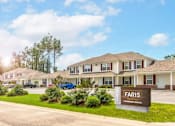 Thumbnail 1 of 25 - A FARIS sign is in front of a building.