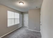 Thumbnail 21 of 33 - Beige Carpet In Bedroom at The Hub at 934 Apartments, Georgia, 30349