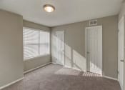 Thumbnail 32 of 33 - Carpeted Bedroom at The Hub at 934 Apartments, Georgia, 30349