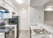 Thumbnail 5 of 33 - Granite Countertop Kitchen at The Hub at 934 Apartments, Atlanta, GA
