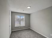 Thumbnail 16 of 37 - an empty room with a window and carpet at The Sapphire, Decatur, 30035