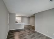 Thumbnail 6 of 37 - an empty living room and kitchen with a hard wood floor at The Sapphire, Decatur