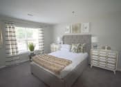 Thumbnail 15 of 37 - a white bedroom with a bed and a window  at The Sapphire, Decatur, GA, 30035