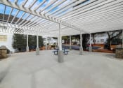 Thumbnail 34 of 37 - a covered patio with benches under a white canopy at The Sapphire, Decatur, Georgia