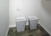 Thumbnail 18 of 37 - a bathroom with two baskets on the floor at The Sapphire, Decatur, GA