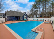 Thumbnail 33 of 37 - a swimming pool with a house in the background at The Sapphire, Decatur, Georgia