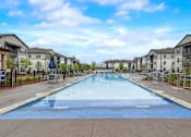 Thumbnail 12 of 39 - Beautiful Swimming pool at Century Mundy Mill Apartments, Oakwood, Georgia