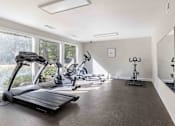 Thumbnail 15 of 18 - A spacious room with exercise equipment and a large window. at Grove at St. Andrews, Columbia, SC