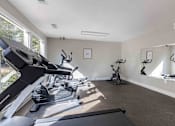 Thumbnail 16 of 18 - A room with treadmills and exercise bikes. at Grove at St. Andrews, South Carolina