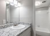 Thumbnail 31 of 34 - a bathroom with a sink and a bathtub at Summit Augusta, Augusta, GA