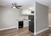 Thumbnail 30 of 34 - a kitchen and living room with a ceiling fan at Summit Augusta, Augusta, 30909