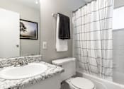 Thumbnail 23 of 34 - a bathroom with a sink toilet and bathtub at Summit Augusta, Augusta, 30909