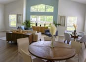 Thumbnail 2 of 13 - a living room and dining room with a table and chairs at Retreat at Savannah, Savannah, GA