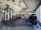 Thumbnail 27 of 37 - fitness center featuring free weights at Palmetto Place, Fort Mill
