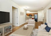 Thumbnail 3 of 31 - a living room with a couch and a tv