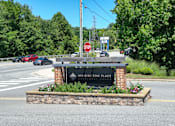 Thumbnail 9 of 27 - the sign at the intersection of a road with a stop sign