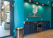 Thumbnail 26 of 36 - The Waters at Seltzerville is a modern establishment with a blue wall and a logo on it.