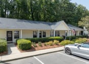 Thumbnail 2 of 19 - a house with a car parked in front of it