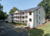 Thumbnail 5 of 19 - exterior view of an apartment building with white siding and balconies