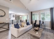 Thumbnail 6 of 17 - the living room of a home with a couch and a table