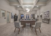 Thumbnail 46 of 49 - a clubhouse with a large table and chairs in the center of it at Century HomePlace, Prattville