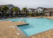 Thumbnail 35 of 49 - our apartments have a large swimming pool with chairs at Century HomePlace, Prattville, AL